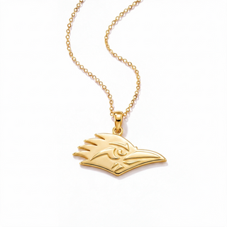 A gold pendant necklace featuring a stylized bird head profile on a delicate gold chain, photographed against a clean white background.