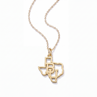 A gold necklace featuring a pendant shaped like the state of Texas, with the letters 'B' and 'J' integrated into the design, suspended from a delicate gold chain on a white background.