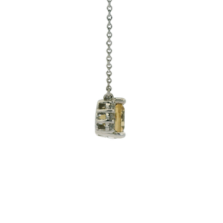 citrine pendant on a chain against a white background