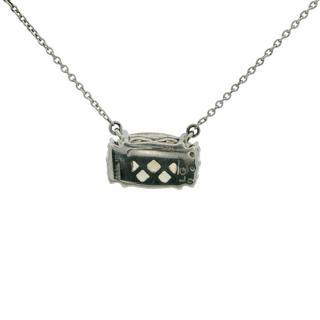 citrine pendant on a chain against a white background