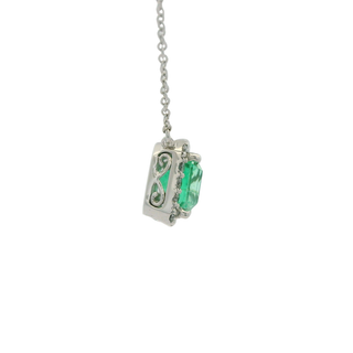 Necklace with a green emerald cut emerald pendant on a white background