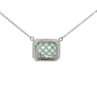 Necklace with a green emerald cut emerald pendant on a white background