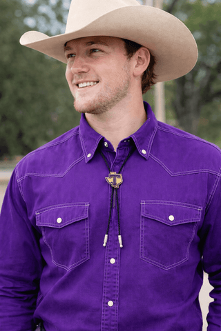 tarleton state of texas in yellow gold with purple enameled tarleton t bolo with black cords on cowboy