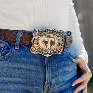 Person wearing a belt with a Tarleton State University  buckle.
