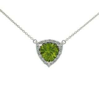triangle shaped green peridot necklace on a white background
