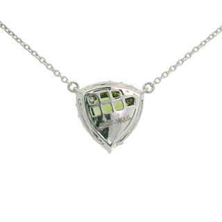 triangle shaped pendant necklace with green gemstones on a white background