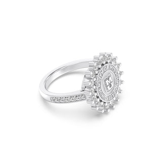 Silver mizzou class ring with diamond accents on the band a white background