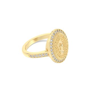 Yellow gold class ring with a university of texas san antonio health science center seal on a white background