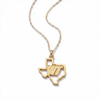 A gold necklace featuring a pendant shaped like the state of Texas, with the letters 'WT' inlaid in the center, suspended from a delicate gold chain on a white background.